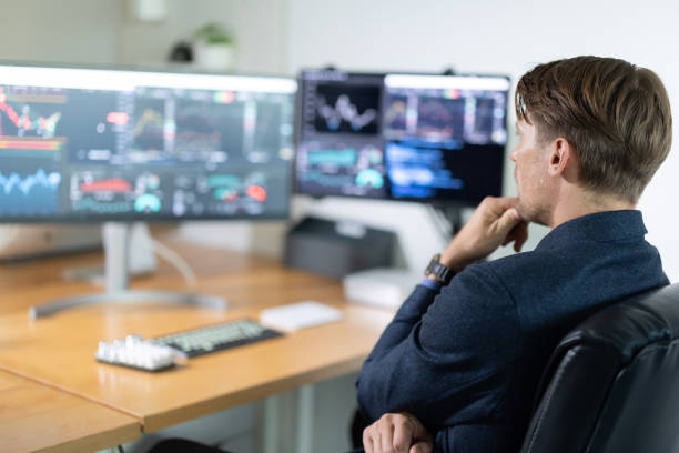 istock Businessman analyzing market trends at a modern office 2198859930