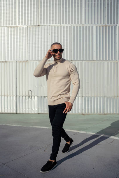 istock Young man in urban setting with sunglasses 2198860712