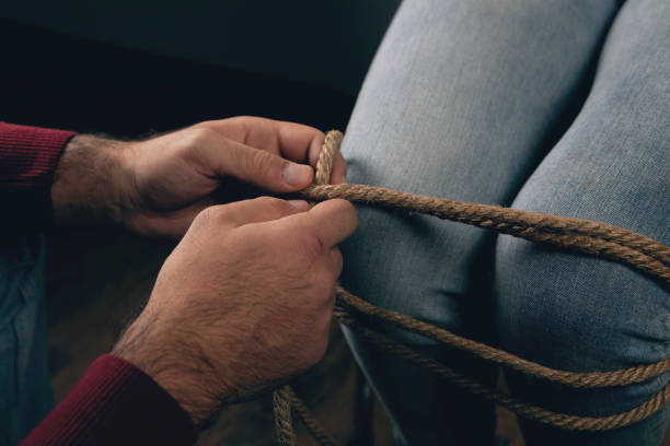istock a man bondagely binds a woman 2198860766