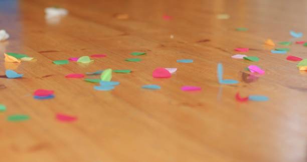 istock A vibrant array of colorful confetti scattered on a wooden floor 2198863007