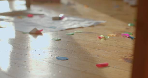 istock There are Scattered Colorful Confetti and Papers Randomly on the Floor 2198864528
