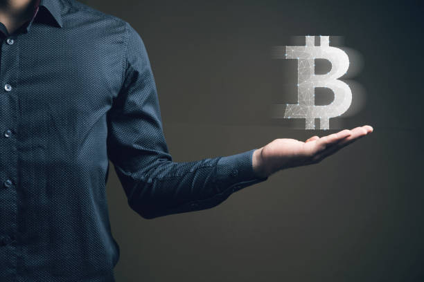 istock bitcoin from the network. cryptocurrency. man holding in his hand 2198865049