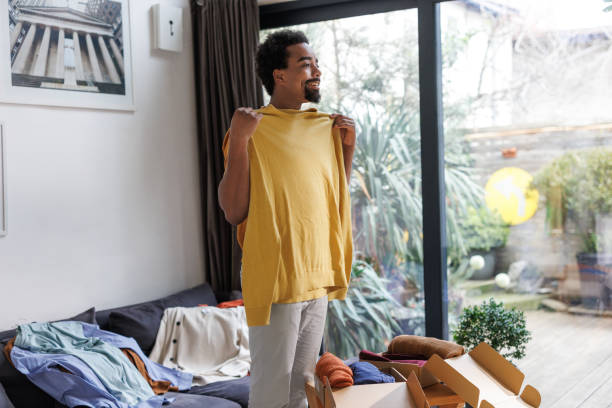 istock Man trying on new clothes after online shopping 2198865356