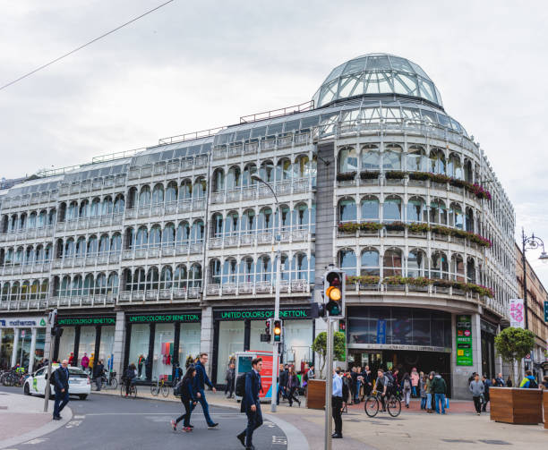 DUBLIN, IRELAND - SEPTEMBER 19, 2018: The glass-domed Stephen's Green Shopping Centre in Dublin with pedestrians and cyclists in motion.