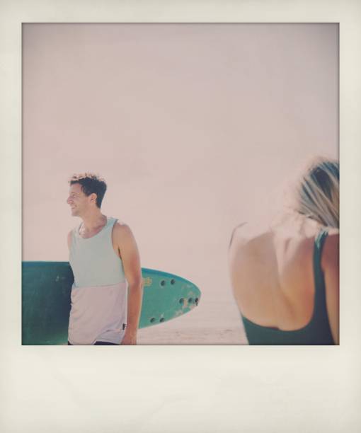 Photo of a smiling couple spending hot summer afternoon at the local beach
