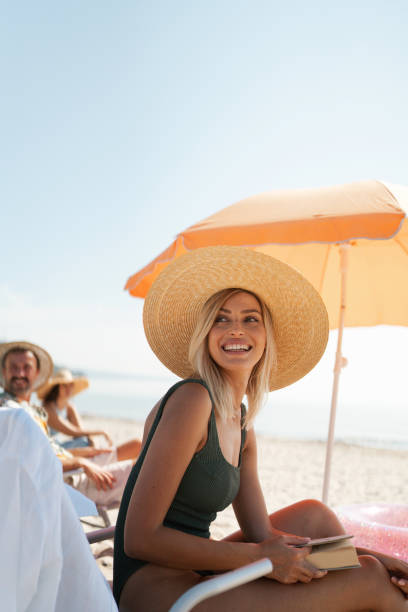 istock Relaxing on the local beach with my friends 2198866260