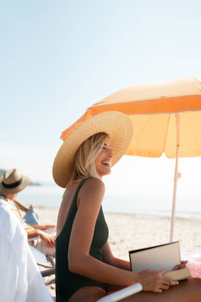 istock Relaxing on the local beach with my friends 2198866281