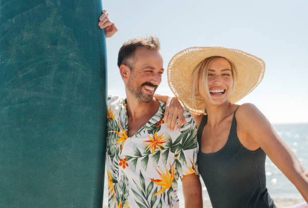 istock Happy couple enjoing day at the beach. 2198866430