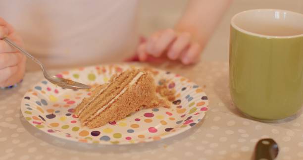istock Enjoying a Coffee alongside a Slice of Cake on a Charming Polka Dot Plate 2198867120
