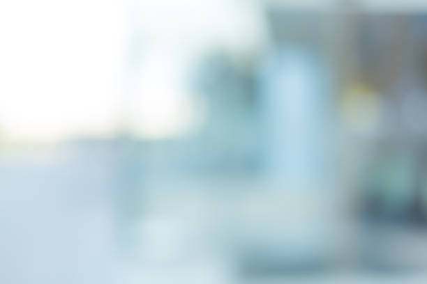 istock White blur background,Blurred abstract  grey glass wall from building background. 2198868597