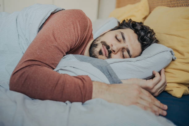 istock Young handsome middle eastern man sleeping peacefully in his bed. 2198868847