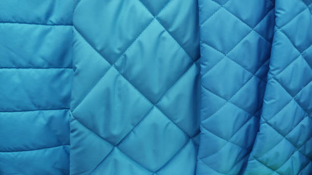 istock Sample of quilted textile blue color close up texture 2198870817