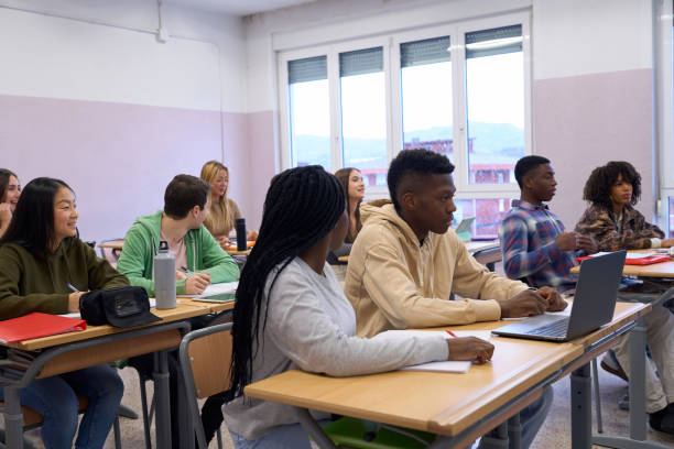 istock High school students listening to the teacher in classroom 2198873213