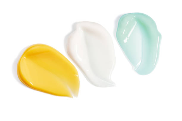 istock Three smooth, glossy cosmetic smears isolated on white background ideal for showcasing skincare products texture 2198876319