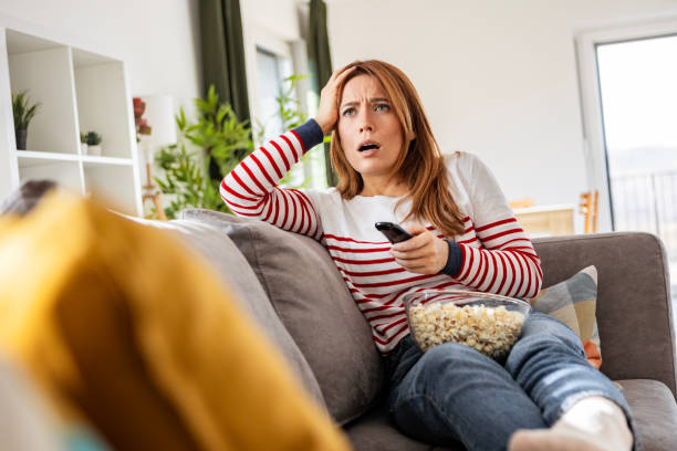 istock Woman Relaxing with Popcorn 2198877631