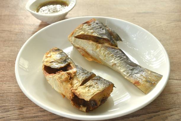 istock deep fried salty tiger fish dipping Thai spicy seafood sauce 2198880006