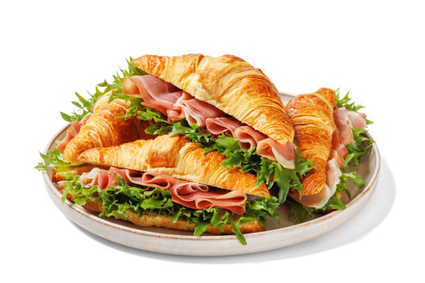 istock croissant sandwiches with ham and lettuce on plate 2198881297