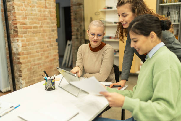 istock Beautiful business women collaborating on a project in office 2198881375