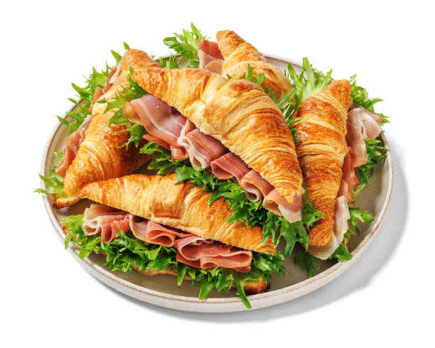 istock croissant sandwiches with ham and lettuce on plate 2198881704