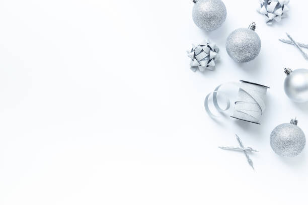 istock Silver colored Christmas and New Year decorations on white background, top view 2198882942