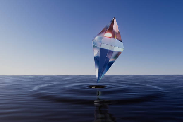 istock A crystal shaped like an ice cube is floating on the surface of the water 2198885094