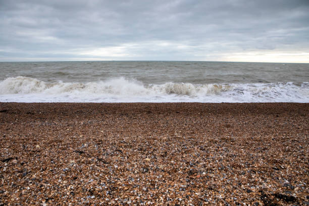 Waves crashing on the pebble beach at Hove, Sussex