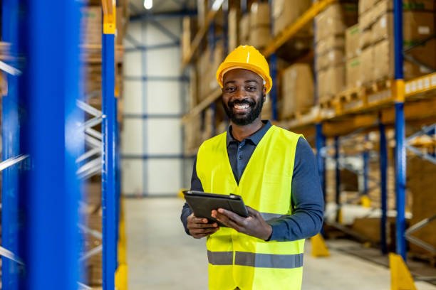 istock Warehouse Employee With Digital Tablet Smiling in Organized Industrial Storage Area 2198895854