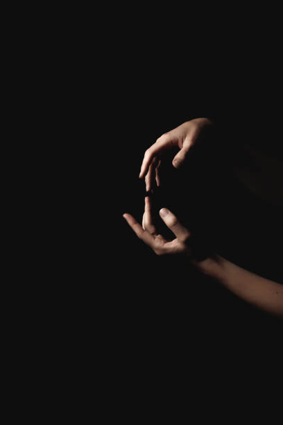 istock Delicate hands creating heart silhouette on shadowy surface, expressing tender emotional bond and romantic connection book cover copy space 2198897546