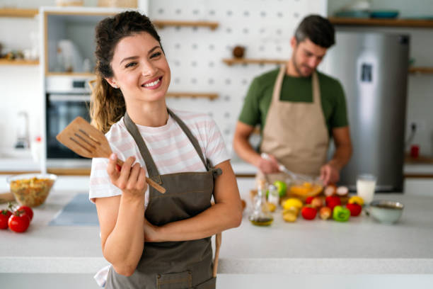 istock A young couple in love having good time while preparing a breakfast together on a beautiful morning 2198898701