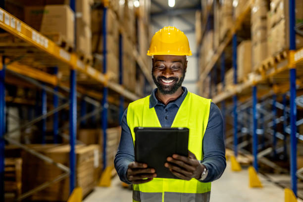istock Warehouse Worker Using Tablet for Inventory Management and Digital Organization 2198899386