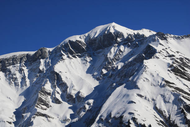 istock Piz Segnas in winter seen from Elm, Switzerland. 2198903381