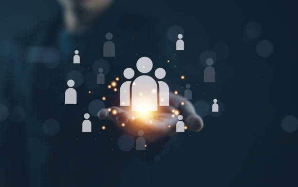 istock A person holds a glowing light, symbolizing connection and community, surrounded by icons representing individuals and collaboration. 2198904854