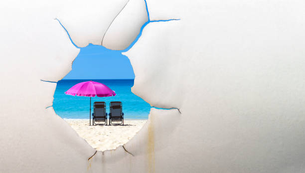 Top view on summer tropical beach with beach chairs, umbrella and sun accessories. Summer travel concept. 3d render