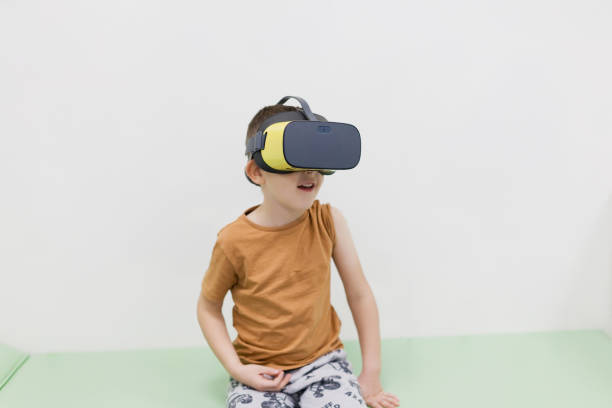 istock Caucasian boy in vr glasses clinic 2198905897