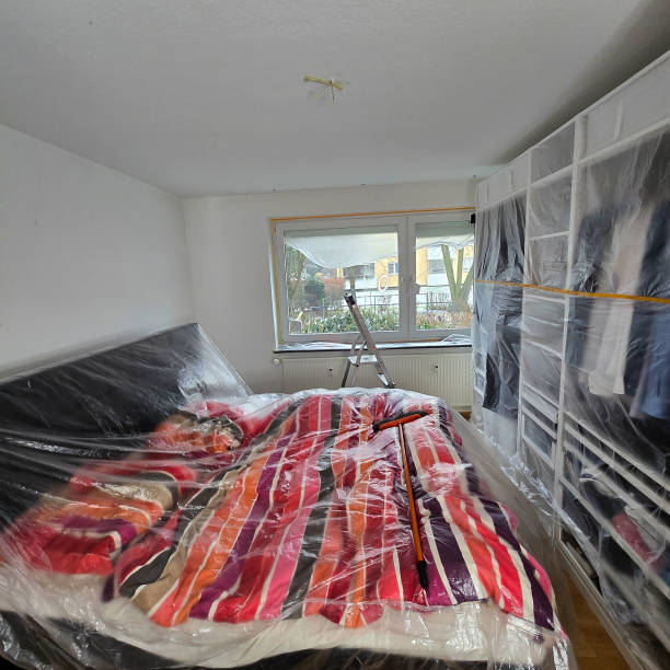 istock A modern bedroom setup featuring plastic protection to ensure the space remains clean and tidy 2198906233