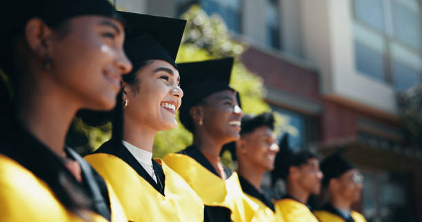 istock Graduation, success and event for celebration, group and happy for education, diploma and scholarship. Outdoor, smile and people with knowledge, achievement and woman with cap in university or degree 2198907832