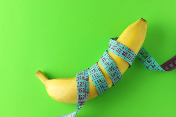 Banana with tape for measuring figure.