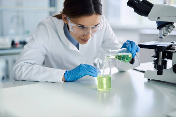 istock Female chemist testing new chemical substances in a laboratory. 2198909021