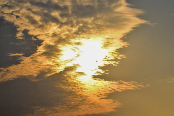Dramatic colorful cloudscape with the sunbeam at the sunset. Sunlight through the clouds. Sunset skyscape, sunset background. Nature concept