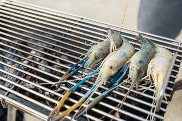 Giant river prawn take place on the grid for grilled, is a delicious food.