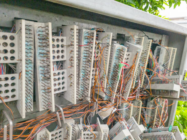 istock Telephone Box with destroyed cables, wires and connectors 2198910909