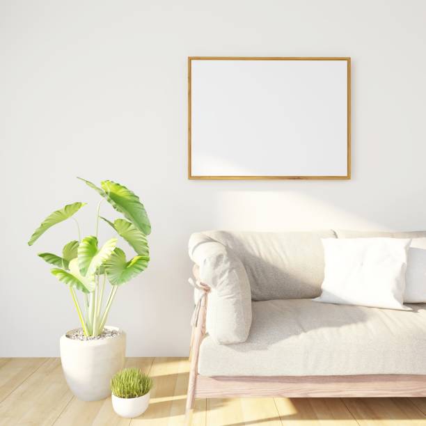 istock Living room with a blank horizontal frame mockup, natural interior decoration with plants and a lamp 2198911218