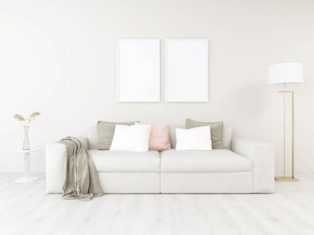 istock Fresh and minimal living room with two vertical blank frame mockups, beige sofa, ornamental plant and lamp 2198911266