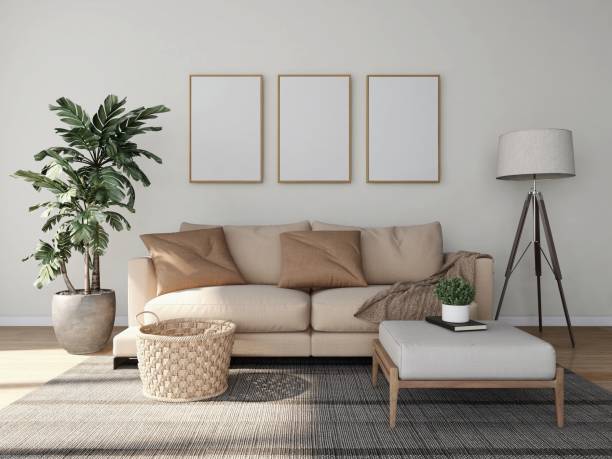 istock Living room with three vertical frame mockups, light sofa and interior decoration with ornamental plants, lamp and basket 2198911990