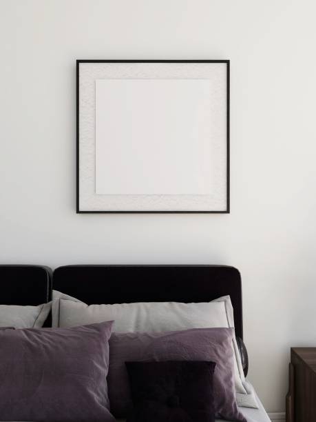 istock Bedroom with a square frame mockup and a bed with several pillows 2198912033