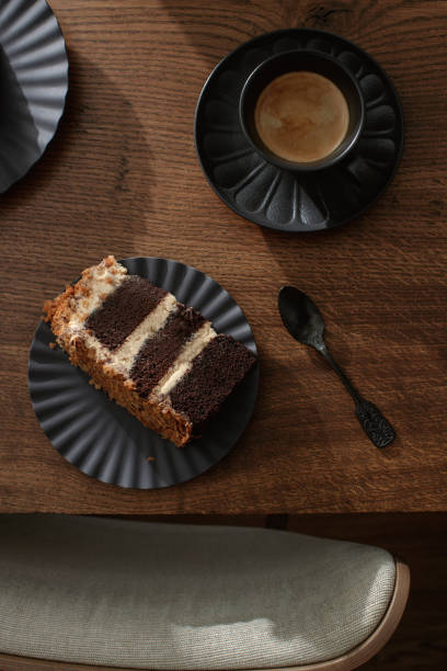istock Dark chocolate handmade cake served on black plate on oak table 2198912688