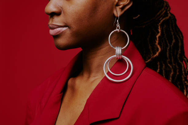 istock Wearing Large Hoop Earrings Against Red Background 2198919905