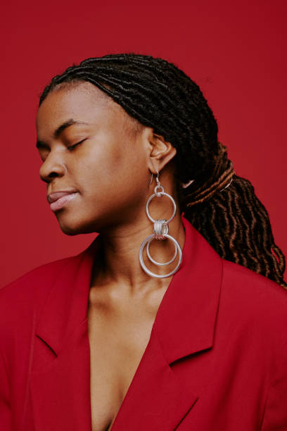 istock Woman Wearing Red Blazer With Eyes Closed Reflecting Calmness 2198919919
