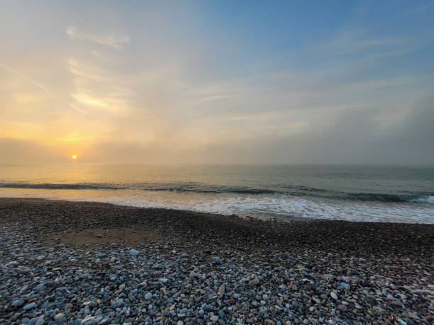 istock Pebble Beach at Sunset with Soft Golden Light 2198920542