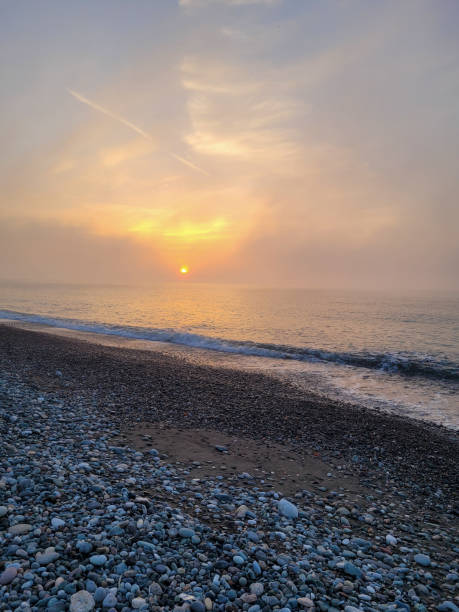 istock Pebble Beach at Sunset with Soft Golden Light 2198920551